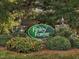 Finley Forest community sign surrounded by lush landscaping and greenery at 228 Finley Forest Dr, Chapel Hill, NC 27517