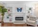 Bright living room featuring a fireplace with built-in shelving and decorative accents at 228 Finley Forest Dr, Chapel Hill, NC 27517