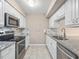 Well-lit kitchen featuring stainless steel appliances and granite countertops at 228 Finley Forest Dr, Chapel Hill, NC 27517