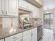 Kitchen pass-through overlooking the living area, with modern granite countertops and backsplash at 228 Finley Forest Dr, Chapel Hill, NC 27517
