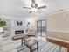 Inviting living area with fireplace, ceiling fan, and sliding glass door for natural light at 228 Finley Forest Dr, Chapel Hill, NC 27517