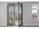 This bedroom has French doors leading to the outside and a nice view at 228 Woodsborough Pl, Raleigh, NC 27601