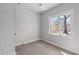 Sunlit bedroom with hardwood floors, neutral walls, and a large window offering a pleasant view at 228 Woodsborough Pl, Raleigh, NC 27601