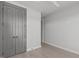 Neutral bedroom with hardwood floors and a spacious closet, providing ample storage space at 228 Woodsborough Pl, Raleigh, NC 27601