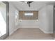 This bedroom has a ceiling fan, light colored hardwood floors, and accent wall at 228 Woodsborough Pl, Raleigh, NC 27601