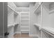 Spacious walk-in closet with custom shelving and ample storage, perfect for organizing wardrobes at 228 Woodsborough Pl, Raleigh, NC 27601
