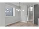 Elegant dining room with modern chandelier, offering a stylish space for Gathering meals and entertaining at 228 Woodsborough Pl, Raleigh, NC 27601