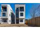 Modern exterior showcasing the home's design, windows, and small balcony at 228 Woodsborough Pl, Raleigh, NC 27601