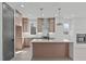 Spacious kitchen with a center island, stainless steel appliances, and modern finishes at 228 Woodsborough Pl, Raleigh, NC 27601