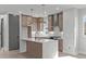Bright kitchen featuring shaker cabinets, stainless appliances, and white quartz countertops at 228 Woodsborough Pl, Raleigh, NC 27601