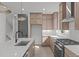 Spacious kitchen with a center island, stainless steel appliances, and modern finishes at 228 Woodsborough Pl, Raleigh, NC 27601