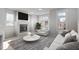 Bright living room with fireplace, hardwood floors, and ample natural light at 228 Woodsborough Pl, Raleigh, NC 27601