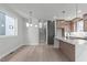 Inviting open floor plan with dining area and kitchen, perfect for entertaining and modern living at 228 Woodsborough Pl, Raleigh, NC 27601