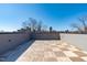 Beautiful rooftop deck with wood pavers and a downtown view at 228 Woodsborough Pl, Raleigh, NC 27601