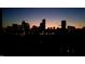 City skyline with silhouetted buildings and colorful sunset at 228 Woodsborough Pl, Raleigh, NC 27601