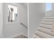Stylish stairway features modern wood handrail, wood steps, and recessed lighting at 228 Woodsborough Pl, Raleigh, NC 27601