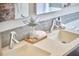Close-up of a bathroom with dual sinks, modern faucets, and decorative accents at 2618 Elgin St, Durham, NC 27704