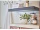 Bathroom decor with towels and toiletries on a shelf, adding style and functionality at 2618 Elgin St, Durham, NC 27704
