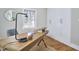 Stylish home office with a wooden desk, modern lamp, and functional storage cabinets at 2618 Elgin St, Durham, NC 27704