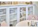 White kitchen cabinets with glass doors accent the dining area, offering a blend of storage and style at 2618 Elgin St, Durham, NC 27704