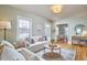 Cozy living room with plush seating, natural light, and seamless transition to the dining area at 2618 Elgin St, Durham, NC 27704