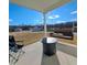 Covered back porch with outdoor furniture, including a porch swing and outdoor table at 265 Forest Meadow Ln, Franklinton, NC 27525