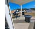 Covered back porch with outdoor seating, a grill, and a fire pit, overlooking the backyard at 265 Forest Meadow Ln, Franklinton, NC 27525