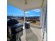 Covered back porch with ceiling fan, a porch swing, fire pit, and grill at 265 Forest Meadow Ln, Franklinton, NC 27525