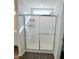 Bathroom with sliding glass shower doors, white shower surround, and chrome hardware at 265 Forest Meadow Ln, Franklinton, NC 27525