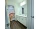 Bathroom featuring a double sink vanity with a view to a colorful shower curtain at 265 Forest Meadow Ln, Franklinton, NC 27525