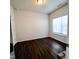 An empty bedroom boasts hardwood floors and a window to bring in natural light, ready for personal touches at 265 Forest Meadow Ln, Franklinton, NC 27525