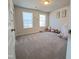 Bedroom featuring neutral carpet, two windows, and soft natural light, perfect for a serene space at 265 Forest Meadow Ln, Franklinton, NC 27525