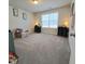 Bedroom with neutral carpet, a centered window, and matching black dressers on either side at 265 Forest Meadow Ln, Franklinton, NC 27525