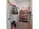Walk-in closet featuring wire shelving and a wooden dresser for maximum storage at 265 Forest Meadow Ln, Franklinton, NC 27525