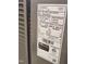 Close-up of a Lennox HVAC label with technical specifications and certification details for the outdoor unit at 265 Forest Meadow Ln, Franklinton, NC 27525