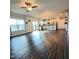 Spacious living room featuring hardwood floors, bright windows, and an open layout to the kitchen with barstool seating at 265 Forest Meadow Ln, Franklinton, NC 27525