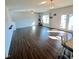 Bright living room with wood flooring, neutral walls, staircase, and a view to the outdoor patio at 265 Forest Meadow Ln, Franklinton, NC 27525