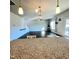 Spacious living area featuring modern lighting, staircase and dark wood flooring at 265 Forest Meadow Ln, Franklinton, NC 27525