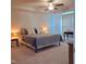 Comfortable main bedroom featuring a ceiling fan and large windows with sheer curtains at 265 Forest Meadow Ln, Franklinton, NC 27525