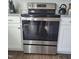 Stainless steel oven and range with digital display sits between white cabinets and light granite countertops at 265 Forest Meadow Ln, Franklinton, NC 27525
