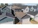 Overhead shot showcases a backyard and screened in patio between a home and detached garage at 283 Dry Canyon Dr, Wendell, NC 27591