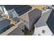 Aerial view of a home exterior showing attached garage, yard, and neighboring properties on a sunny day at 283 Dry Canyon Dr, Wendell, NC 27591