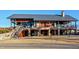 A stone building with a metal roof houses a cafe for residents at 283 Dry Canyon Dr, Wendell, NC 27591