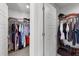 Spacious walk-in closet with ample storage including shelves, hanging rods, and clothing at 283 Dry Canyon Dr, Wendell, NC 27591