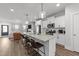 Bright open kitchen with stainless steel appliances, quartz counters, and eat in island at 283 Dry Canyon Dr, Wendell, NC 27591