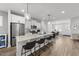 Stylish kitchen with granite countertops, stainless steel appliances, and bar stool seating at the island at 283 Dry Canyon Dr, Wendell, NC 27591