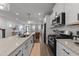 Bright modern kitchen featuring stainless appliances and quartz countertops at 283 Dry Canyon Dr, Wendell, NC 27591