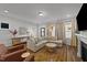 Bright and inviting living room with a fireplace, comfortable seating, and seamless flow to the entryway at 283 Dry Canyon Dr, Wendell, NC 27591