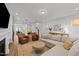 Spacious living room with a fireplace, comfortable seating, and an open layout to the dining and kitchen areas at 283 Dry Canyon Dr, Wendell, NC 27591