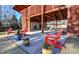 Outdoor pavilion with fireplace, ceiling fans, and Adirondack chairs for relaxing at 283 Dry Canyon Dr, Wendell, NC 27591